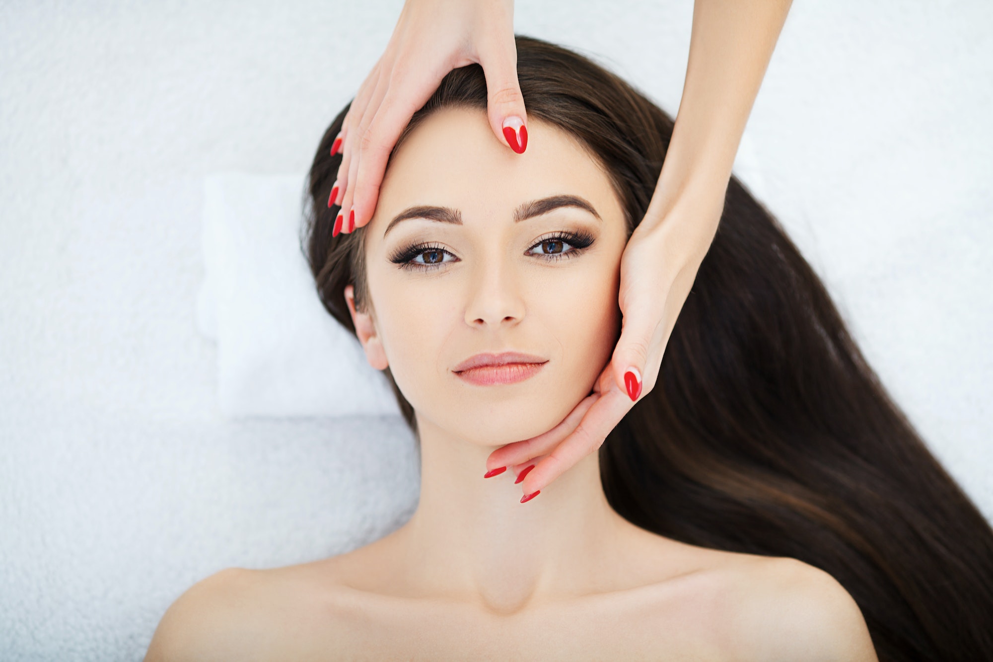 Beautiful Young Woman Getting a Face Treatment at Beauty Salon. Beautiful Young Woman Getting a Face Treatment at Beauty Salon.