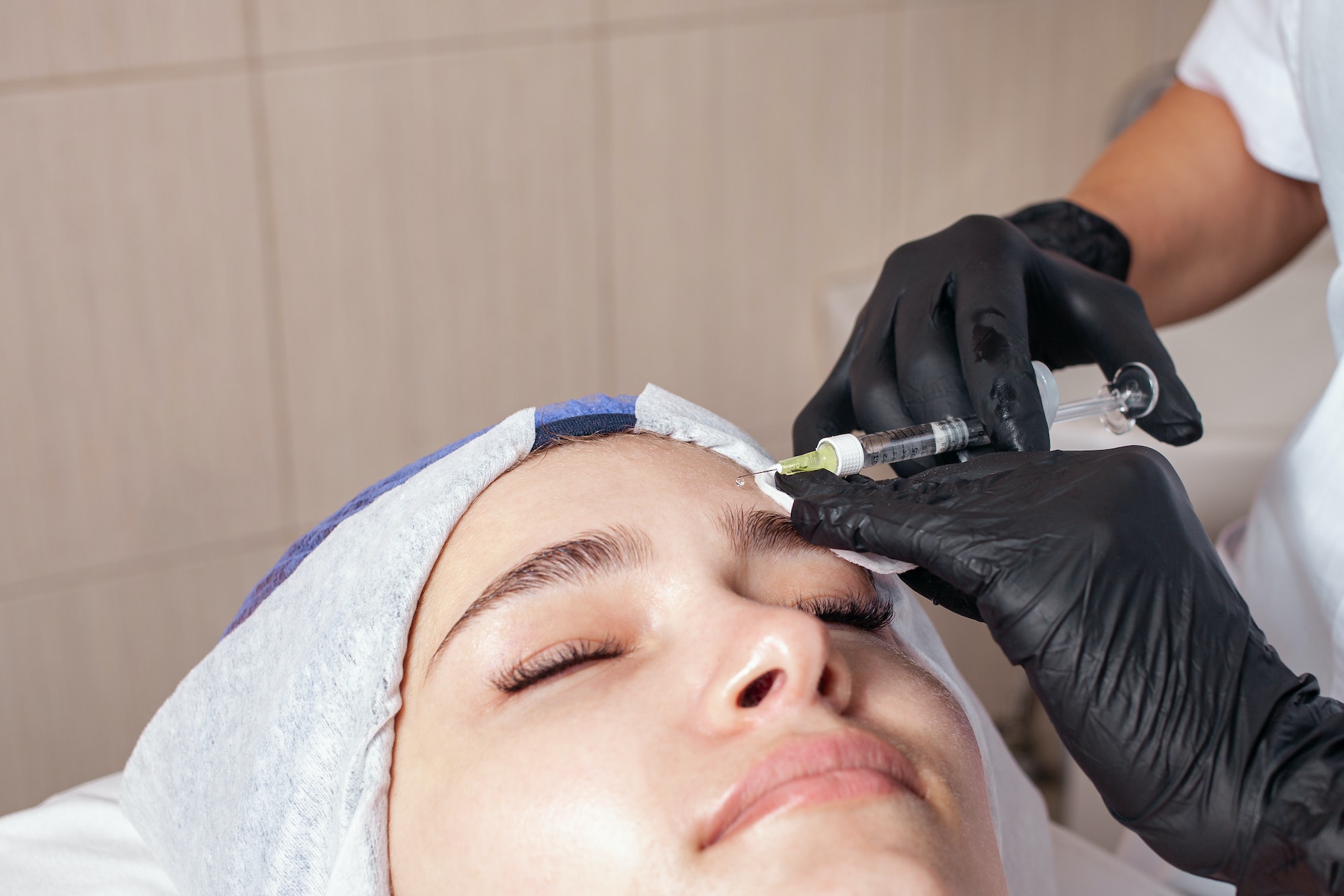 The beautician performs the procedure of mesotherapy The beautician performs the procedure of mesotherapy