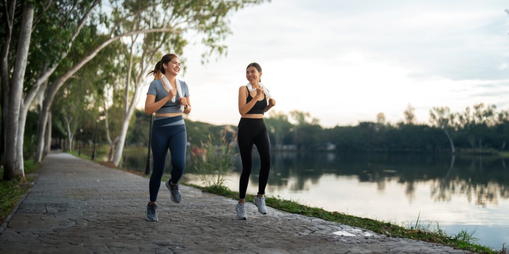 Healthy and active lifestyle, sport concept. Attractive ecstatic young sportswoman, smiling