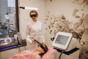 Portrait of a beautiful woman master of laser hair removal in a beauty salon