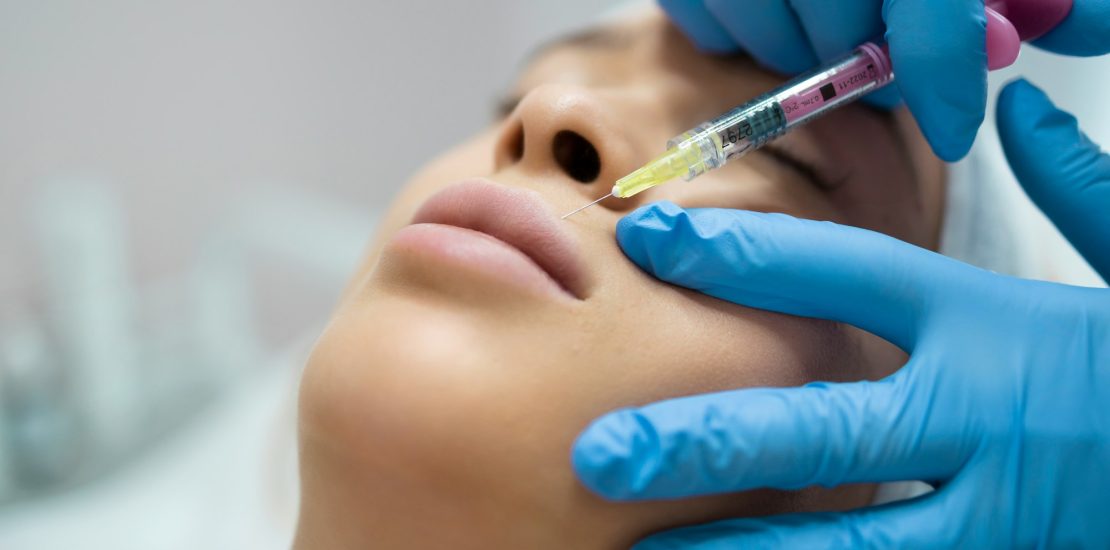 Lip augmentation and correction procedure close-up. Hyaluronic acid injection