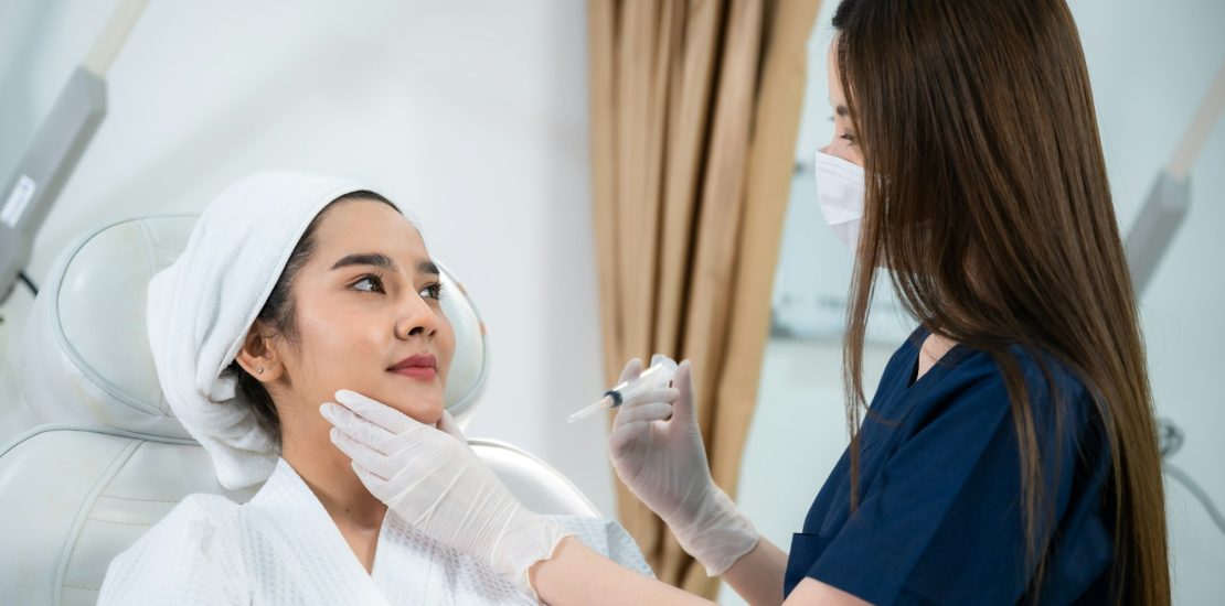 young Asian woman having oedema after face injection